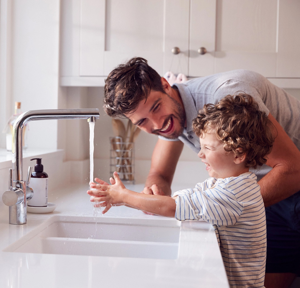 Father son washing hand